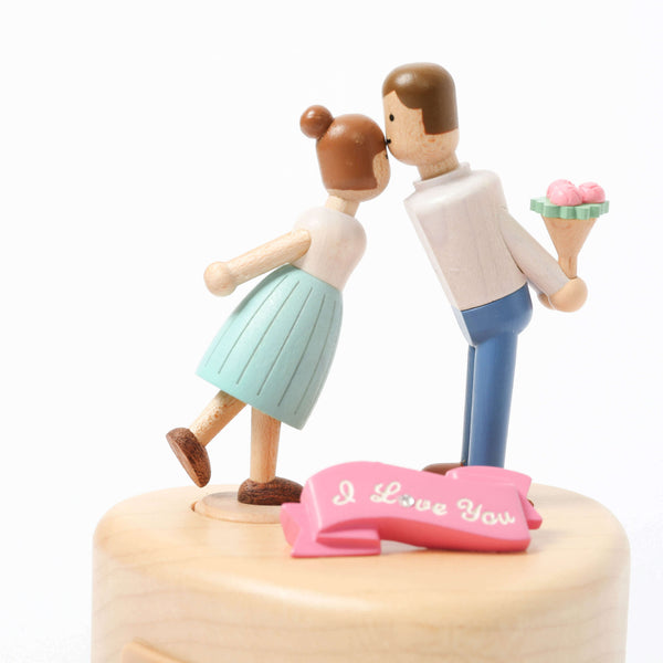 Man Kissing Girl on Forehead