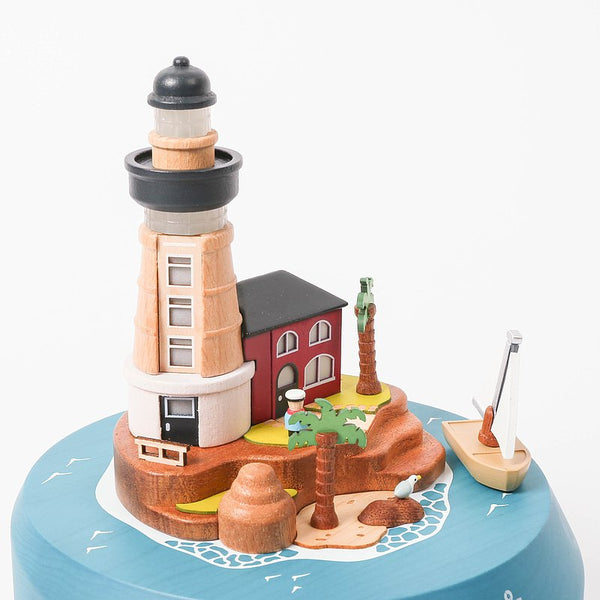 Lighthouse And Sailboat