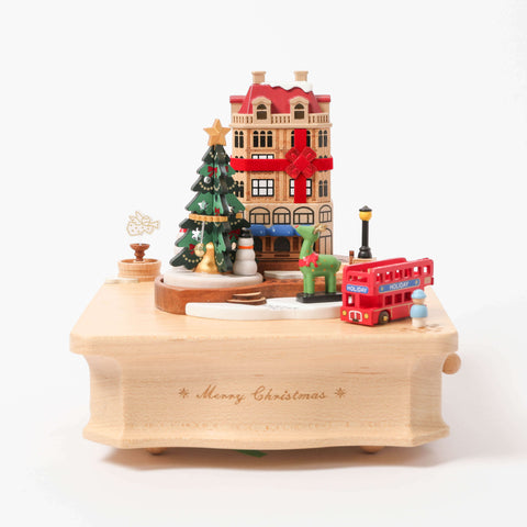 Christms City With Christmas Tree And Green Reindeer